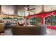 Inviting outdoor patio area with stylish seating, wood ceilings, an outdoor fireplace and beautiful garden views at 5501 Highland S St, St Petersburg, FL 33705