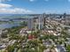 Aerial view showing home surrounded by lush greenery, city skyline, and bay views at 635 Bay Ne St, St Petersburg, FL 33701