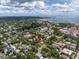 Expansive aerial view of a charming neighborhood near the bay with lush green trees and clear blue skies at 635 Bay Ne St, St Petersburg, FL 33701