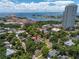 Aerial view of home nestled among trees with a view of the bay and city landmarks at 635 Bay Ne St, St Petersburg, FL 33701