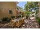 Charming brick-paved backyard with patio table and chairs, surrounded by lush landscaping at 635 Bay Ne St, St Petersburg, FL 33701