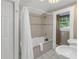 Bright bathroom with a soaking tub, window, and neutral tile, providing a serene space at 635 Bay Ne St, St Petersburg, FL 33701
