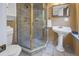 Well-appointed bathroom with a corner shower, tiled walls, pedestal sink, and essential toiletries for a modern touch at 635 Bay Ne St, St Petersburg, FL 33701