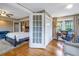 Bedroom view including a sitting area, desk, and closet; lots of natural light with wood flooring throughout at 635 Bay Ne St, St Petersburg, FL 33701