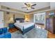 Bright, spacious bedroom with a four-poster bed, hardwood floors, and access to a connected sitting area at 635 Bay Ne St, St Petersburg, FL 33701
