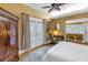 Relaxing bedroom with a writing desk, french doors, and a large wardrobe, perfect for work and relaxation at 635 Bay Ne St, St Petersburg, FL 33701