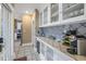 Butler's pantry featuring under-counter refrigerator and countertop coffee station at 635 Bay Ne St, St Petersburg, FL 33701