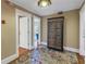 Entryway features hardwood floors, a colorful area rug, and a decorative storage cabinet at 635 Bay Ne St, St Petersburg, FL 33701