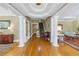 Spacious foyer with hardwood floors, grand columns, and decorative ceiling detail at 635 Bay Ne St, St Petersburg, FL 33701
