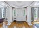 Elegant foyer featuring hardwood floors, white columns, and natural light at 635 Bay Ne St, St Petersburg, FL 33701