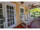 Cozy front porch featuring classic rocking chairs, ideal for enjoying the neighborhood view at 635 Bay Ne St, St Petersburg, FL 33701