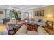 Bright living room featuring hardwood floors, white sofas, and a decorative rug at 635 Bay Ne St, St Petersburg, FL 33701