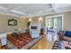 Inviting living room with fireplace, herringbone hardwood floors, and elegant decor at 635 Bay Ne St, St Petersburg, FL 33701