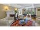 Cozy living room with fireplace, hardwood floors, and comfortable seating at 635 Bay Ne St, St Petersburg, FL 33701