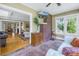 Cozy living room adjacent with brick accent wall and hardwood floors at 635 Bay Ne St, St Petersburg, FL 33701