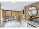 Comfortable living space with tile floors, a dining table, and a mini-fridge, perfect for relaxation and casual meals at 635 Bay Ne St, St Petersburg, FL 33701