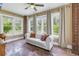 Bright sunroom with large windows, tile floor and comfortable white sofa at 635 Bay Ne St, St Petersburg, FL 33701