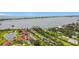 Breathtaking aerial view of Heron Bay Club waterfront residences with lush landscaping and serene lake at 780 Sarabay Rd # 16, Osprey, FL 34229