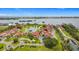 Breathtaking aerial view showcasing community homes with a serene pond and stunning ocean views at 780 Sarabay Rd # 16, Osprey, FL 34229
