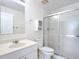 Bathroom features a single sink vanity, frosted glass shower, a toilet, and vanity mirror at 780 Sarabay Rd # 16, Osprey, FL 34229