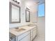Bathroom with double vanity, large mirror, and natural light at 780 Sarabay Rd # 16, Osprey, FL 34229