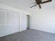 Bedroom featuring double closets and ceiling fan at 780 Sarabay Rd # 16, Osprey, FL 34229
