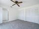 Bedroom featuring a ceiling fan and double closets at 780 Sarabay Rd # 16, Osprey, FL 34229