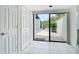 Breakfast area with sliding glass doors leading to a private outdoor patio, tiled flooring, and a nearby closet at 780 Sarabay Rd # 16, Osprey, FL 34229