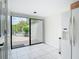 Breakfast area with sliding glass doors leading to a private outdoor patio, tiled flooring, and a refrigerator at 780 Sarabay Rd # 16, Osprey, FL 34229