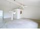 Open-concept living area with tile floors and a pass-through to the kitchen at 780 Sarabay Rd # 16, Osprey, FL 34229