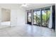 Spacious living room boasts tile floors, a ceiling fan, and sliding glass doors with an outdoor view at 780 Sarabay Rd # 16, Osprey, FL 34229