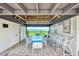 Poolside seating area with ample seating and outdoor grilling space and a great view of the nearby water at 780 Sarabay Rd # 16, Osprey, FL 34229