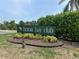 Welcome to Heron Bay Club, a beautiful community with well-maintained landscaping and charming entrance signage at 780 Sarabay Rd # 16, Osprey, FL 34229