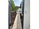 Paver walkway leads to entrance surrounded by lush landscaping at 780 Sarabay Rd # 16, Osprey, FL 34229