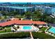 Beautiful aerial view of waterfront condos with pool, marina, and stunning ocean views at 7907 Sailboat Key S Blvd # 108, South Pasadena, FL 33707