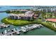 Stunning aerial view of waterfront condos with boat docks, lush grounds, and a park at 7907 Sailboat Key S Blvd # 108, South Pasadena, FL 33707