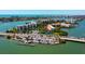 Aerial view of waterfront community and bridge, highlighting the access to the water, nearby city, and tropical landscaping at 7907 Sailboat Key S Blvd # 108, South Pasadena, FL 33707