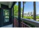 Cozy balcony featuring views of the marina, mature trees, and nearby buildings at 7907 Sailboat Key S Blvd # 108, South Pasadena, FL 33707