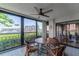 Enclosed balcony with city views, tile flooring, and comfortable seating, ideal for relaxation at 7907 Sailboat Key S Blvd # 108, South Pasadena, FL 33707