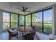 Enclosed balcony with marina views, tile flooring, and comfortable seating for relaxation at 7907 Sailboat Key S Blvd # 108, South Pasadena, FL 33707