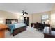 Comfortable bedroom with a ceiling fan, a desk, and neutral walls at 7907 Sailboat Key S Blvd # 108, South Pasadena, FL 33707