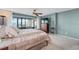 Comfortable bedroom featuring a balcony with a view, dresser, and a ceiling fan at 7907 Sailboat Key S Blvd # 108, South Pasadena, FL 33707