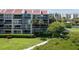 Well-maintained condo building with multiple balconies and manicured landscaping at 7907 Sailboat Key S Blvd # 108, South Pasadena, FL 33707