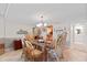 Open dining room featuring rattan chairs, tile flooring, and kitchen views at 7907 Sailboat Key S Blvd # 108, South Pasadena, FL 33707