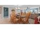 Bright dining area with a glass-top table, seating for six, and stylish decor at 7907 Sailboat Key S Blvd # 108, South Pasadena, FL 33707