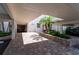 Entrance to 7907 Savannah with brick pavers, beautiful plants, and a black SUV at 7907 Sailboat Key S Blvd # 108, South Pasadena, FL 33707