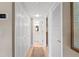 Hallway features a view into the bathroom and access to closet space at 7907 Sailboat Key S Blvd # 108, South Pasadena, FL 33707