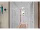 Neutral hallway featuring a view into the bathroom and access to closet space at 7907 Sailboat Key S Blvd # 108, South Pasadena, FL 33707
