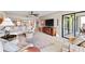 Open living space featuring tile flooring, a ceiling fan, a balcony view and comfortable seating at 7907 Sailboat Key S Blvd # 108, South Pasadena, FL 33707