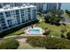 A serene pool area surrounded by lush landscaping and comfortable lounge chairs by the bay at 7907 Sailboat Key S Blvd # 108, South Pasadena, FL 33707